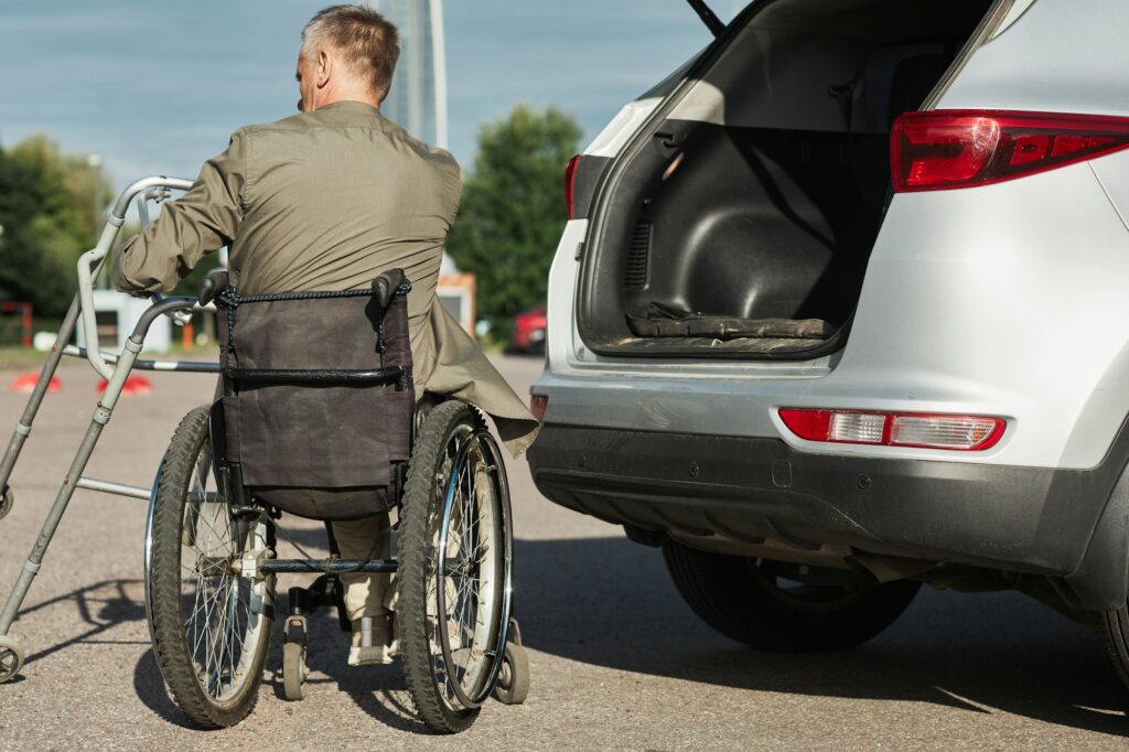 Man in Wheelchair in Parking Lot